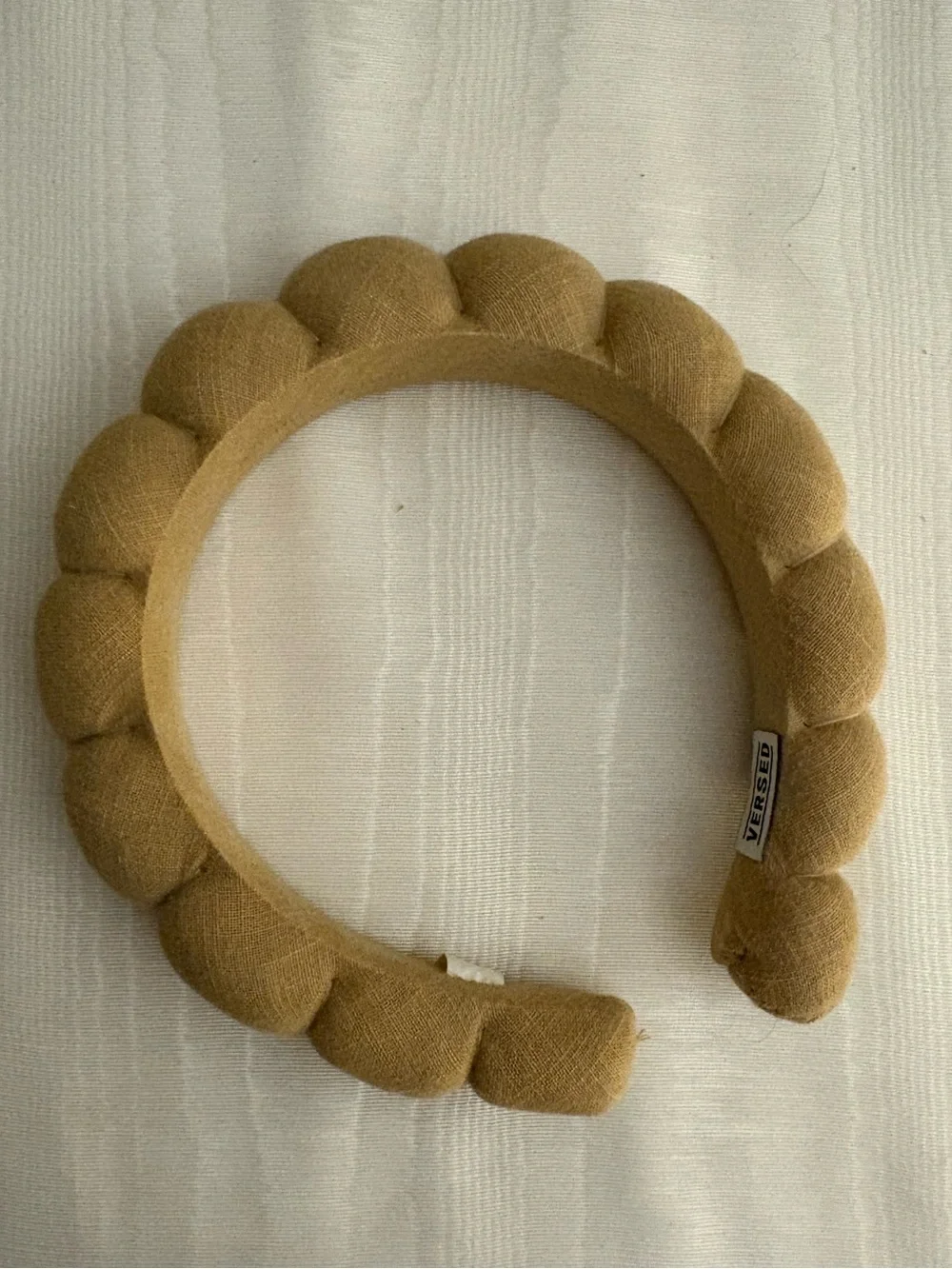 Versed croissant style tan linen headband